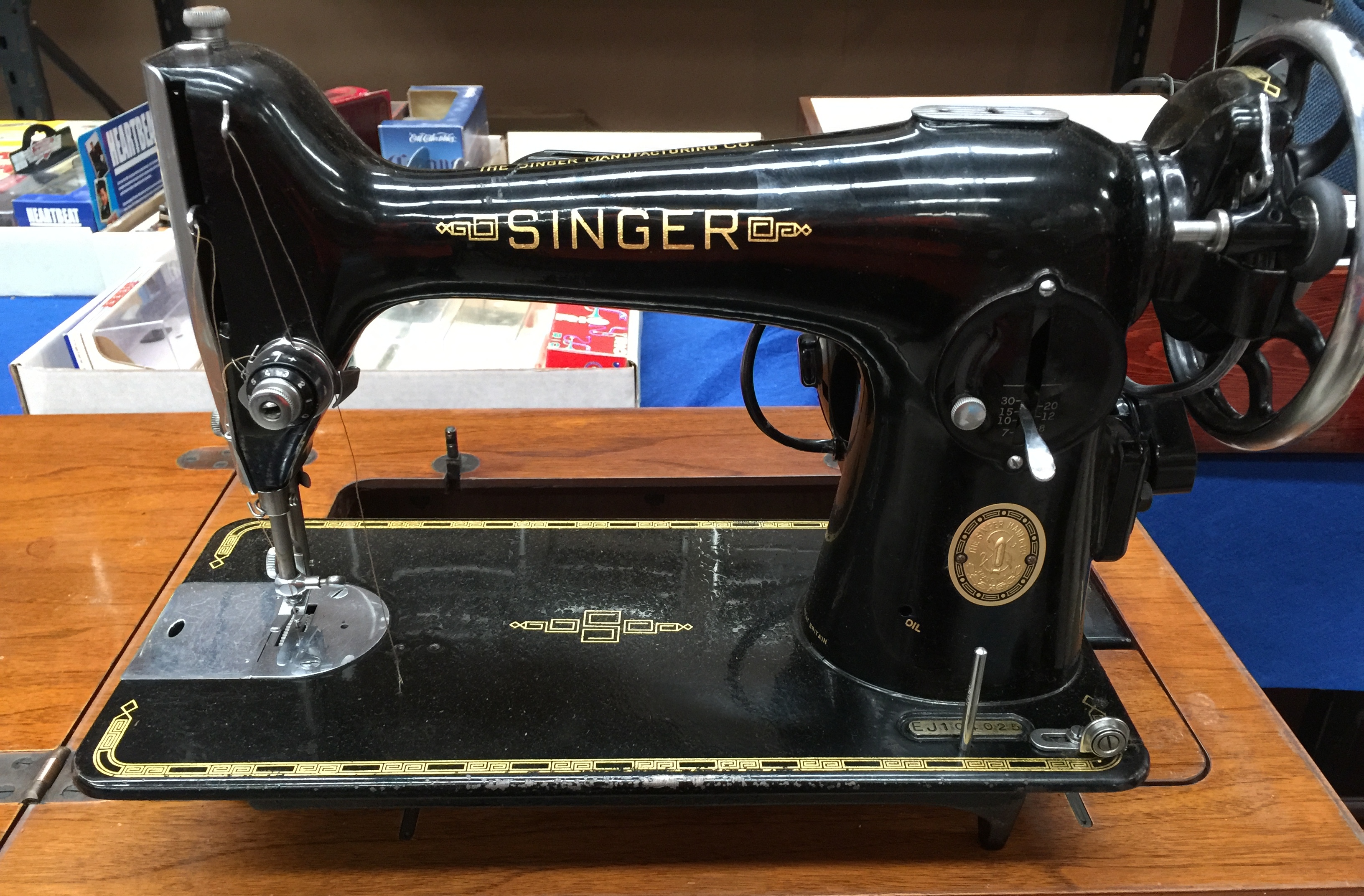 Singer treadle sewing machine adapted for electricity,