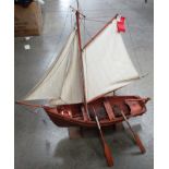 A wooden model of a clinker built sailing Coble, hull length 44.