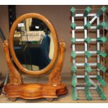 A mahogany swing toilet mirror and a small wine rack