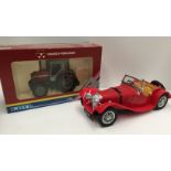 An Ertl 1:32 scale Massey Ferguson tractor (boxed) and a Burago 1:18 scale Jaguar SS 100 1937 -