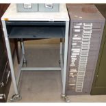 A brown metal 30 drawer freestanding index cabinet and a grey metal framed mobile copier stand (2)