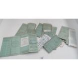 A quantity of old green RF 60 vehicle log books/registration books