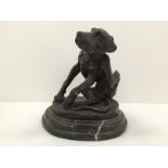 A bronze figure of a hound scratching his ear,