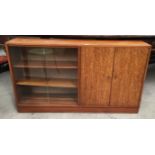 A mahogany 2 door 2 glass sliding door low bookcase/cupboard 136cm together with a collection of