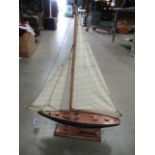 A solid wooden model of a racing yacht,