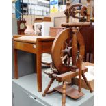 A reproduction spinning wheel and a piano stool (2)