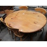 A pine oval dining table 100 x 140cm complete with 4 pine dining chairs