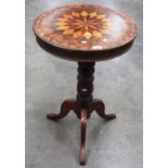 A Victorian inlaid mahogany tripod table