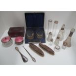 A pair of silver backed military hair brushes and comb in case,