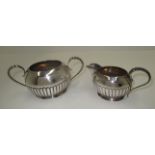 A Victorian silver sugar and cream set, the oval bodies with gadroon decoration and beaded handles,