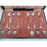 A set of twelve Kings pattern coffee spoons and tongs, Birmingham 1915 [total approximate weight 4.