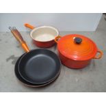 Three Le Creuset pans and a lidded stew pot etc.