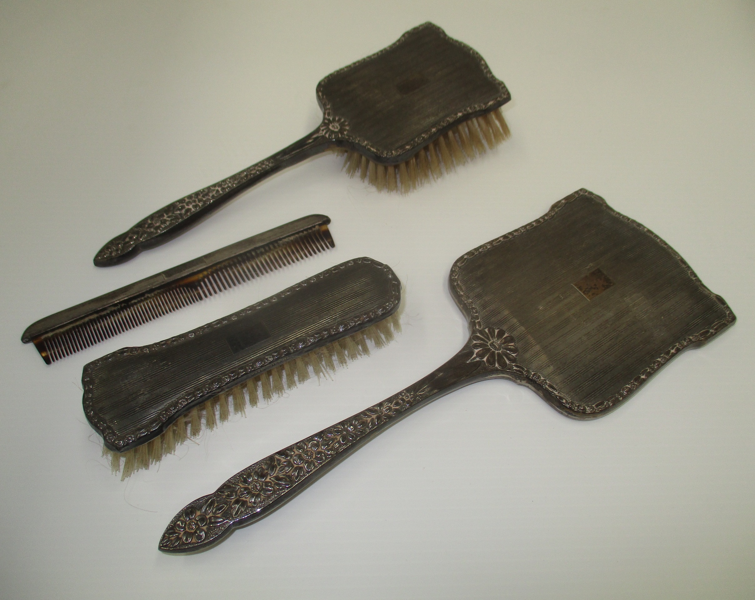 A dressing table set of brushes, mirror and comb,