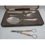 An electroplated three piece confectionery serving set in fitted case and a pair of grape scissors.