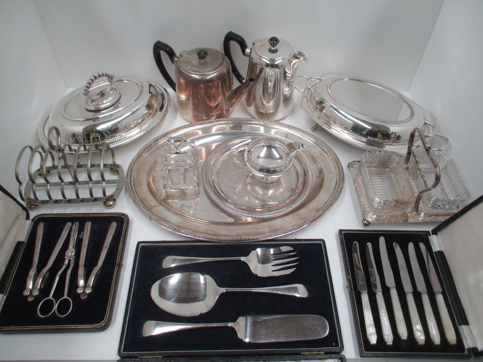 An oval silver plated serving plate, hotel plate, tea and water pots, two toast racks, - Image 2 of 2
