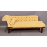 A Victorian beech framed chaise lounge with buttoned back and scroll end,