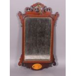 A George III style wall mirror in a mahogany framed the crest with carved and fretted bird ornament