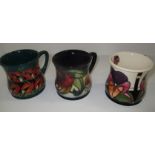 Three Moorcroft mugs "Trilogy",