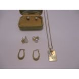 A fine 9ct gold necklace with medallion [approximate weight 4.7g], and three pairs of earrings [7].