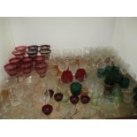 Tray comprising cut and moulded glassware including coloured stem glasses