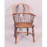 A yew and ash Windsor armchair, the low back with pierced splats,