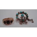 A Victorian 9ct gold wreath shaped brooch set with turquoise and seed pearls, a garnet ring,