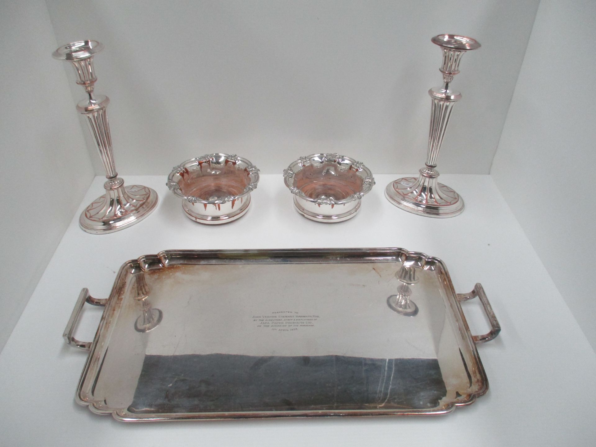 A pair of Sheffield silver plated candle sticks,