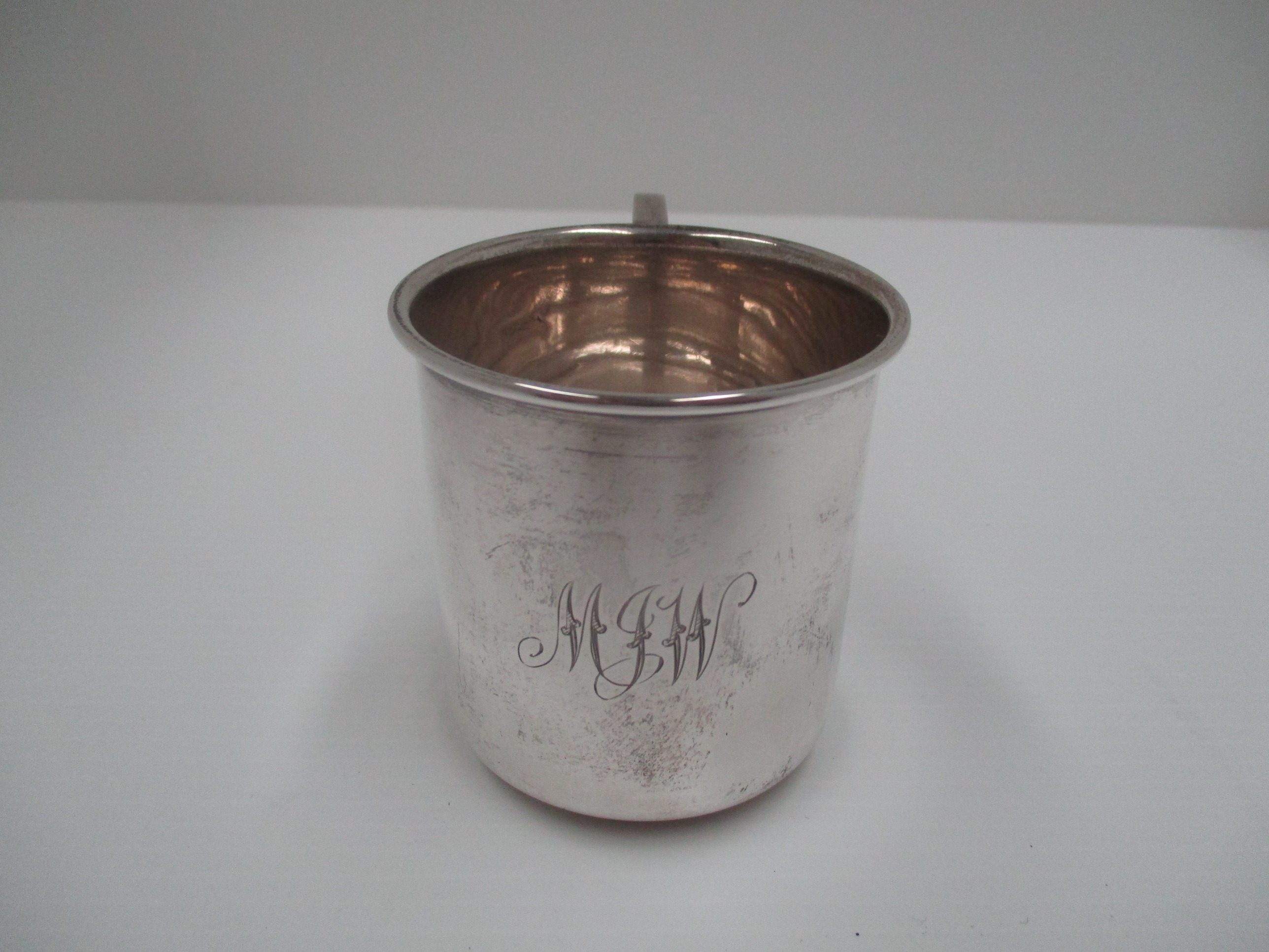 A cylindrical silver half pint mug with flared rim, Birmingham 1939 [approximate weight 4 oz.