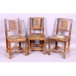 A set of three oak dining chairs with portcullis panel backs and on octagonal baluster legs by