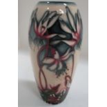 A Moorcroft baluster vase in "Minuet" pattern, 18 cm.