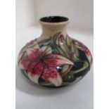 A Moorcroft baluster vase in "Lily of the Field" pattern, 10.5 cm.