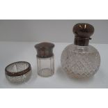 A globular glass scent bottle with silver lid and mount,