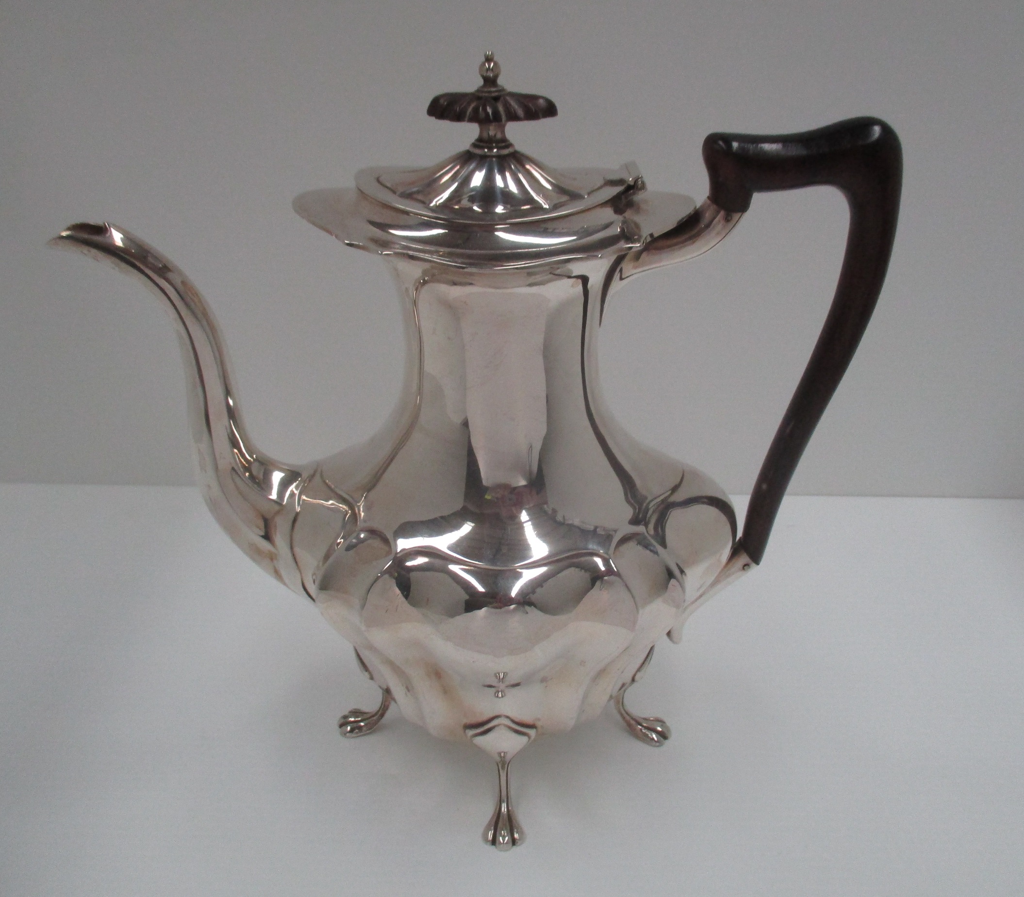 A silver baluster coffee pot with moulded bombé body, on paw feet, by Walker & Hall, Sheffield 1919,