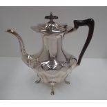 A silver baluster coffee pot with moulded bombé body, on paw feet, by Walker & Hall, Sheffield 1919,