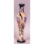 A Moorcroft tall slender baluster vase in "Autumn Sunset" pattern 54/100, signed Rachel Bishop 31.