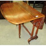 A Victorian mahogany gateleg occasional table with D-end rectangular top on turned pillars and