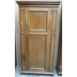 A mahogany hall robe with moulded panel door and sides, on flattened bun feet - 92 cm.