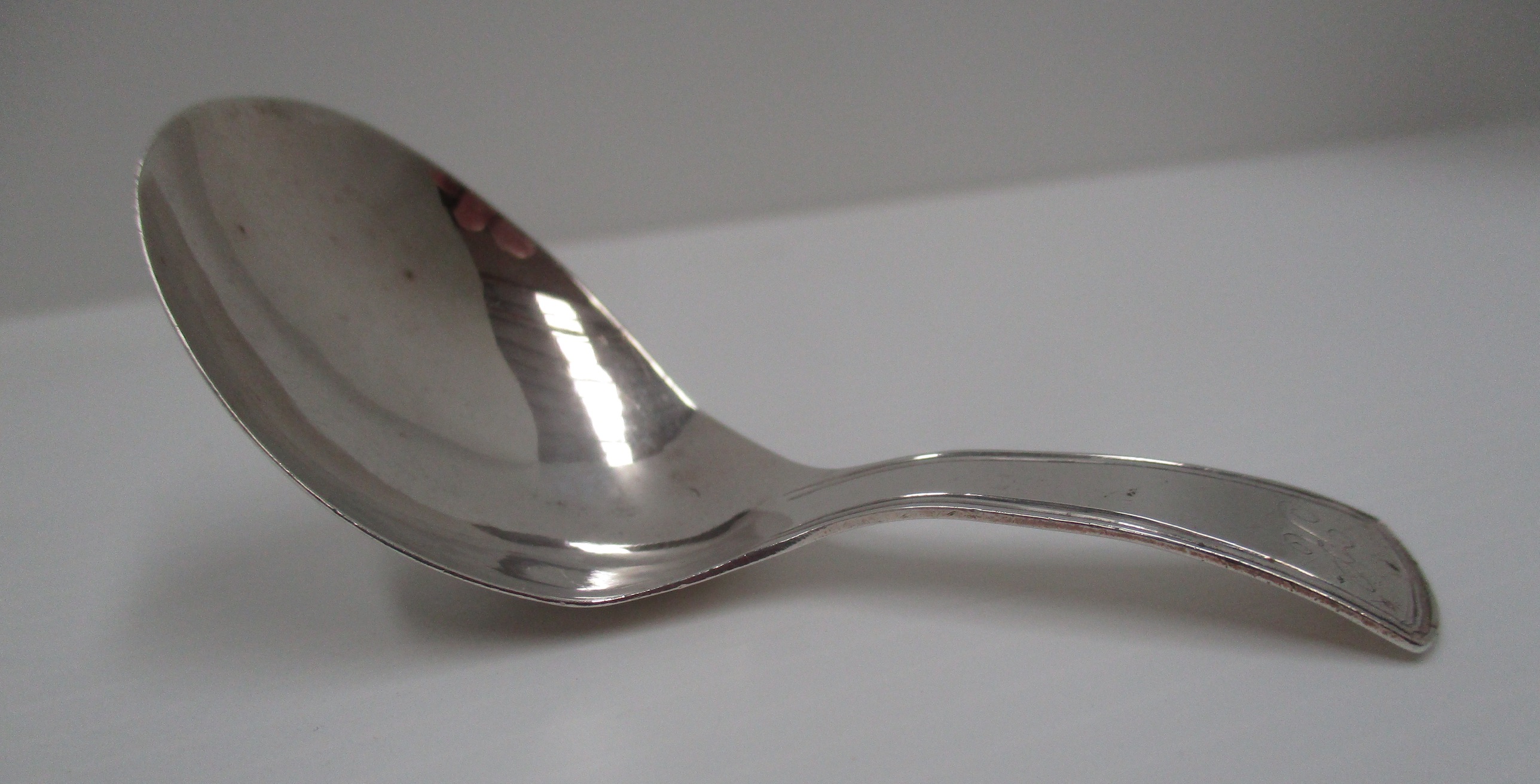 A Geo. III silver caddy spoon with reeded edge handle, London 1807 [approximate weight 0.3 oz].