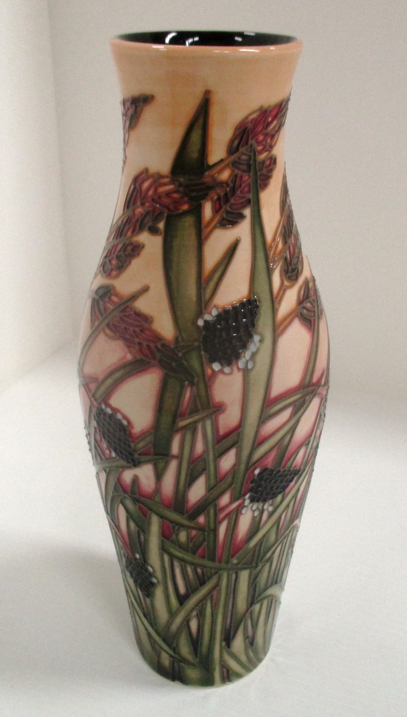 A Moorcroft tall baluster vase in "Savannah" pattern 344/500, signed Emma Bossons, 25.5 cm.