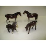 Three Royal Doulton ponies and a foal in brown gloss [4]