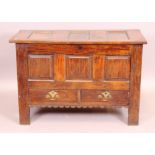 A mid 18th century oak mule chest with panelled lid and front over two drawers - 114 cm.