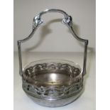 A WMF chrome plated sweets basket with pierced vine leaf border and glass lined