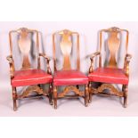 A pair of oak early 18th century style carver chairs with carved crests and panel splats,