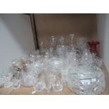 A large accumulation of cut and moulded crystal and glassware including vases, bowls, baskets,