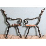 A pair of cast iron garden bench supports,