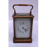 A French brass cased carriage clock with lever movement striking on a coil gong 18cm (handle up)