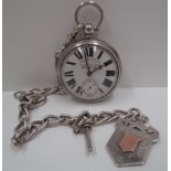 An English lever movement pocket watch in silver case, on heavy silver curb Albert with medallion.