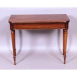 An early 19th century rectangular mahogany folding tea table with curved corners on turned tapered