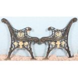 A pair of cast iron garden bench support cast with open scrolls (2)