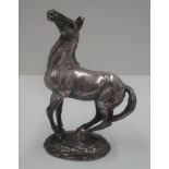 A cast silver model of a horse, 1975, import mark, 11.5 cm [total approximate weight 19.7 oz].